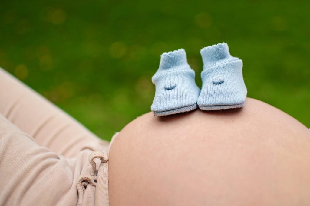 pregnant, baby shoes, belly, pregnancy, pregnant woman, mother, maternity, expecting, woman